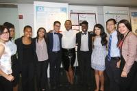 Students pose together at a poster session
